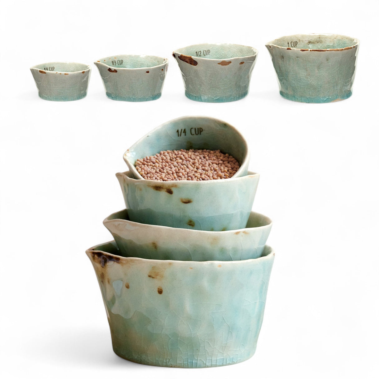Set of four aqua crackle glaze stoneware measuring cups in 1, 1/2, 1/3, and 1/4 cup sizes