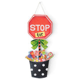 Stop For Candy Halloween door hanger with red stop sign, green bow, and colorful candy bucket