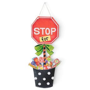 Stop For Candy Halloween door hanger with red stop sign, green bow, and colorful candy bucket