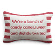 Cotton lumbar pillow with red and natural stripes and embroidered wording reading “We’re a bunch of candy canes, sweet and slightly twisted.”