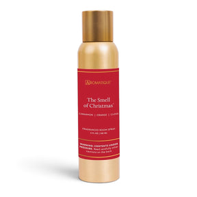 The Smell of Christmas aerosol room spray in a slim gold-tone can with a red Aromatique label and matching gold-tone cap