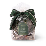 The Smell of Tree 6.5 oz decorative potpourri with pinecones and botanicals in a clear bag with a green Aromatique label and green plaid bow