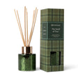The Smell of Tree mini reed diffuser in speckled green metallic glass with a gold-tone collar, natural reeds, and green plaid gift box