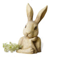 Thinking rabbit head resin sculpture with an antique-style finish on a wooden surface