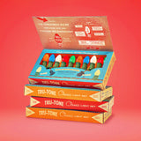 Open box of ten Tru-Tone Classic multicolor Christmas lights stacked on three retro gift boxes.