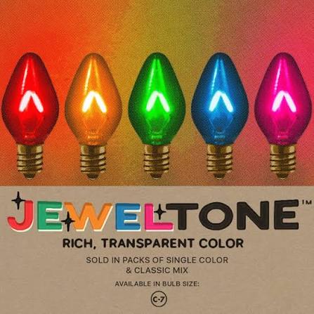 Tru-Tone Jeweltone C7 bulbs in red, amber, green, blue, and pink with visible glowing filaments.
