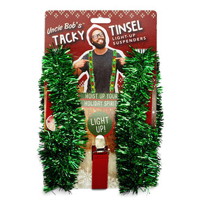 Uncle Bob’s Tacky Tinsel light-up Christmas suspenders with green garland, colorful LED lights, adjustable straps, and metal clips