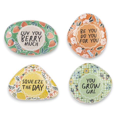 A set of four colorful resin art rocks with motivational messages, featuring floral and fruit designs