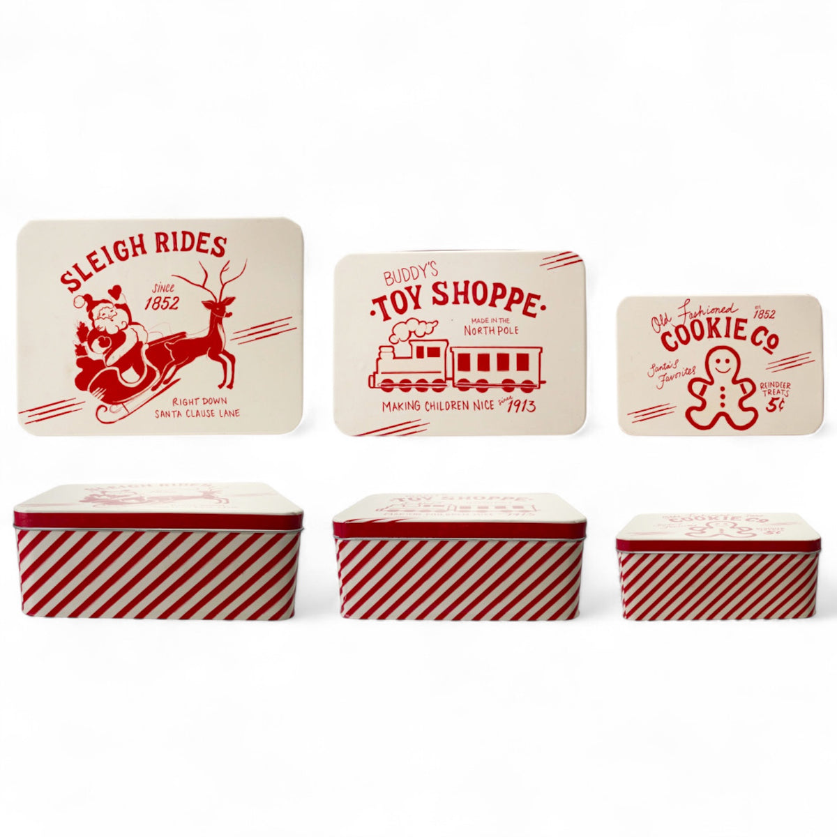red and white striped metal holiday boxes with vintage Christmas designs on lids.