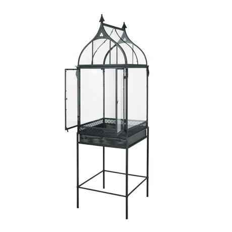 Tall vintage-inspired black metal and acrylic terrarium with legs, featuring dual doors and a peaked roof design for an elegant display by Creative Co-Op