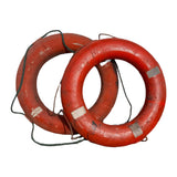 Vintage circular life preserver with natural cording and signs of water life, sourced from watercraft in India.