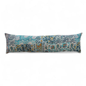 36" lumbar pillow made from vintage rali quilt fabric with hand-embroidered Kantha stitching in blue and yellow tones.