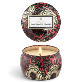 Voluspa Goji Tarocco Orange 4 oz Mini Tin Candle with red, black, and gold floral design