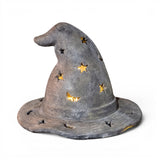 Weathered black cement witch hat Halloween luminary with star and moon cutouts