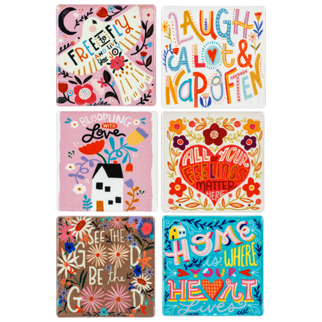 Colorful ceramic fridge magnets with inspirational messages and floral designs.