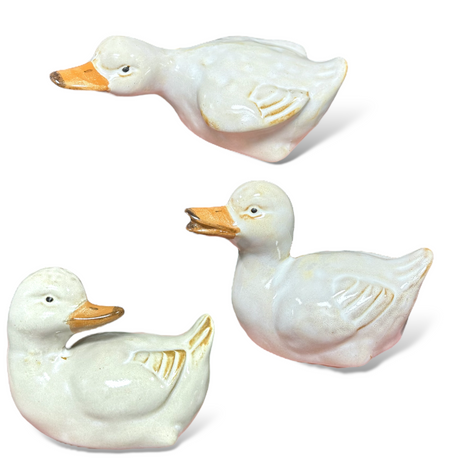 white ceramic duck tabletop decor