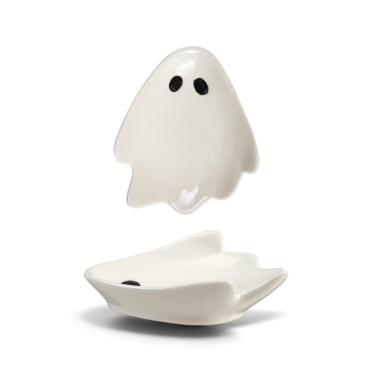 White ceramic ghost-shaped trinket dish with black eyes for Halloween décor