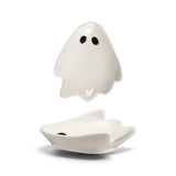 White ceramic ghost-shaped trinket dish with black eyes for Halloween décor
