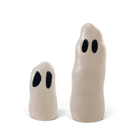 White ceramic Halloween ghosts with black cutout eyes in small and large sizes
