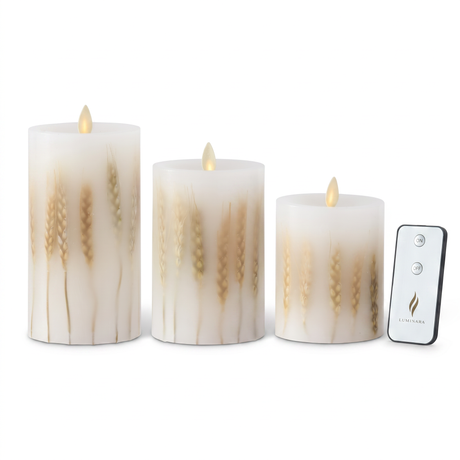 White wax Luminara flameless pillar candles with embedded wheat in three sizes and remote control