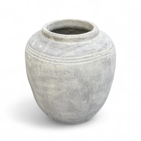 Whitewashed ceramic terracotta vase with aged texture and ribbed detail,