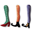 Colorful plush wicked witch leg Halloween pillows in three assorted styles with patterned stockings and witch boots