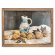 Rustic wood framed glass wall art featuring a still life of lemons and a blue pitcher, measuring 23.5 inches by 17.75 inches.