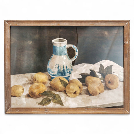 Rustic wood framed glass wall art featuring a still life of lemons and a blue pitcher, measuring 23.5 inches by 17.75 inches.