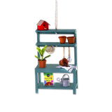 miniature wooden potting bench ornament with clay pots and gardening tools