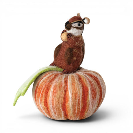 Handmade wool felt chipmunk sitting on an orange pumpkin with acorn and leaf
