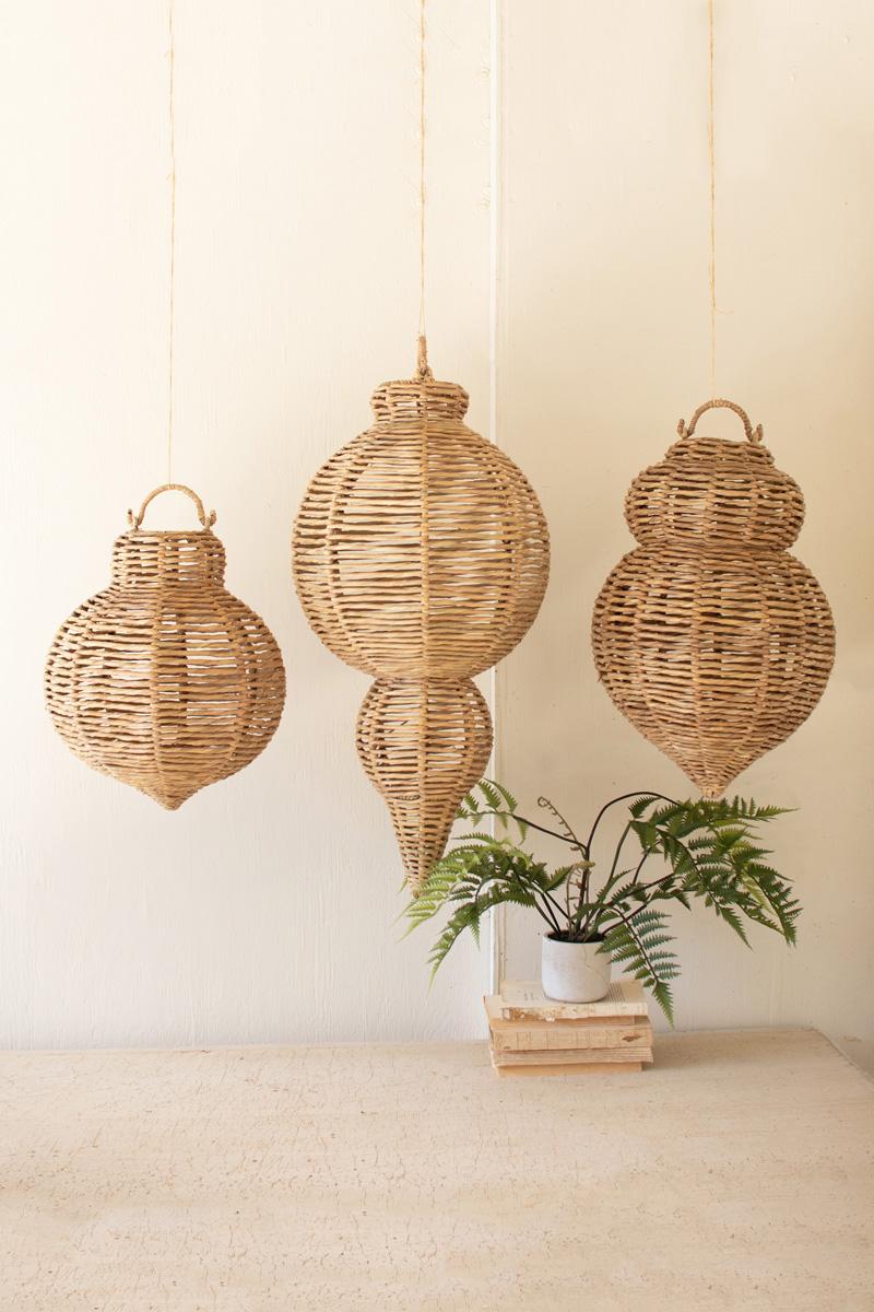 Three oversized woven seagrass and iron hanging ornaments
