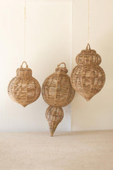 Large woven seagrass ornaments displayed as natural holiday decor