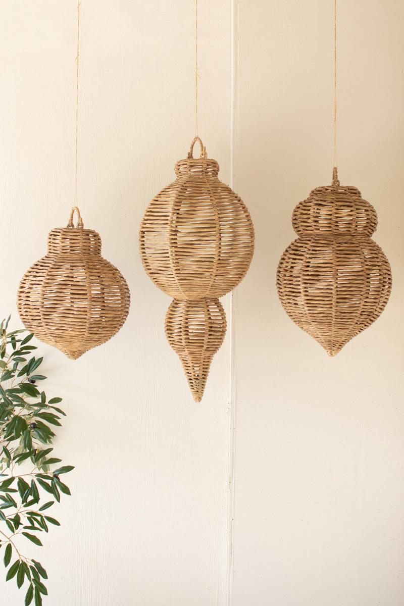 Small medium and large woven seagrass ornaments hanging indoors