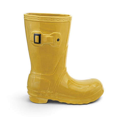 Yellow ceramic rain boot shaped vase with embossed buckle and floral stems